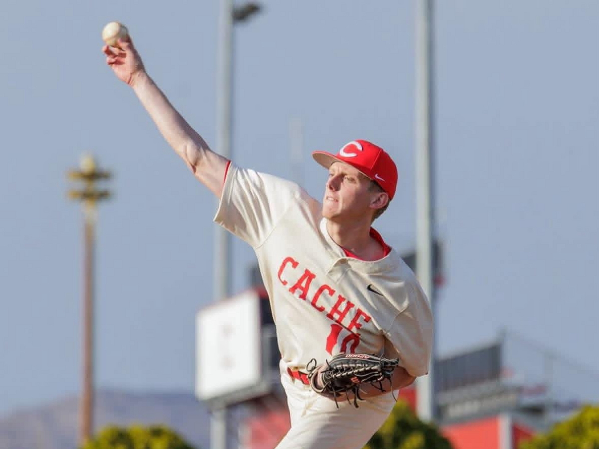 High school student-athlete pitching during a game — the recruit stage of the FORGE journey